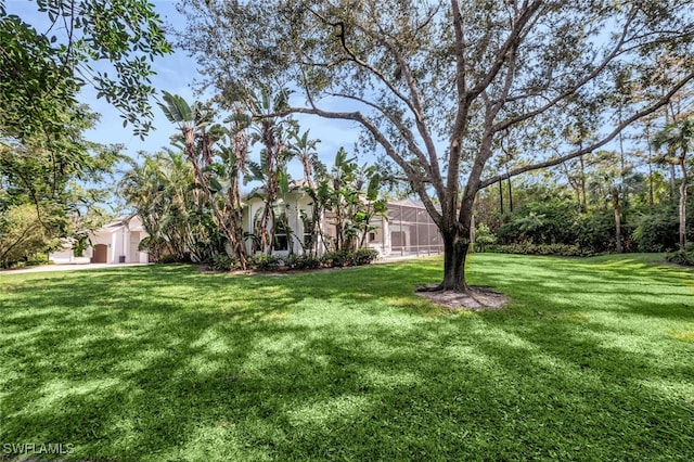 view of yard featuring a lanai