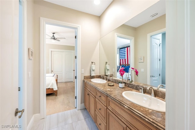 bathroom featuring vanity, tile patterned floors, and ceiling fan