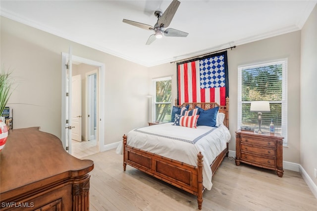 bedroom featuring ceiling fan, light hardwood / wood-style floors, and ornamental molding