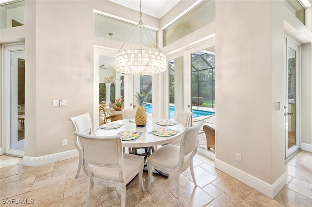 dining room with a notable chandelier and ornamental molding