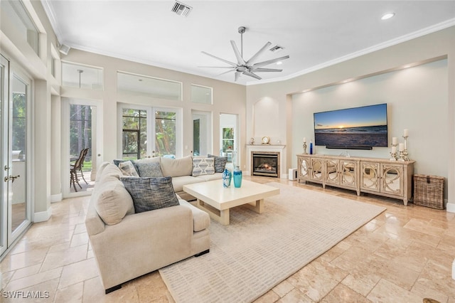 living room featuring ceiling fan, crown molding, and french doors