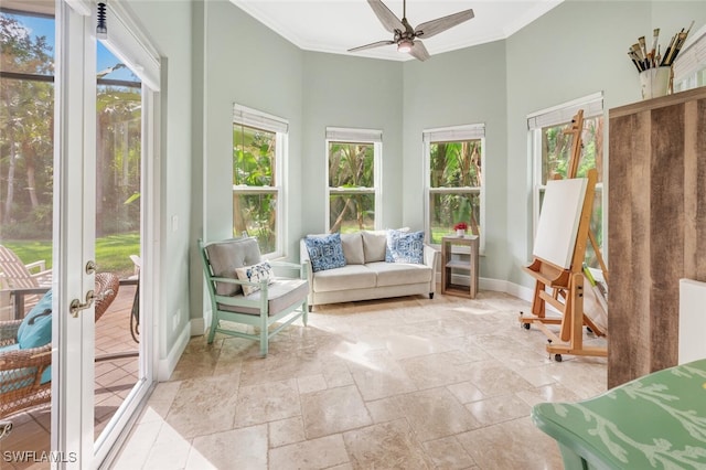 sunroom featuring ceiling fan