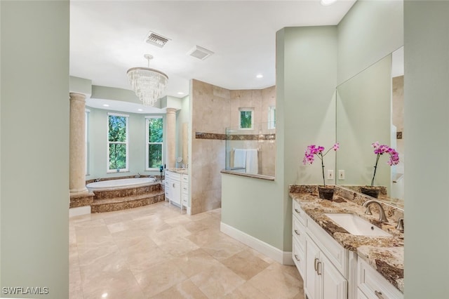 bathroom featuring ornate columns, vanity, independent shower and bath, and an inviting chandelier