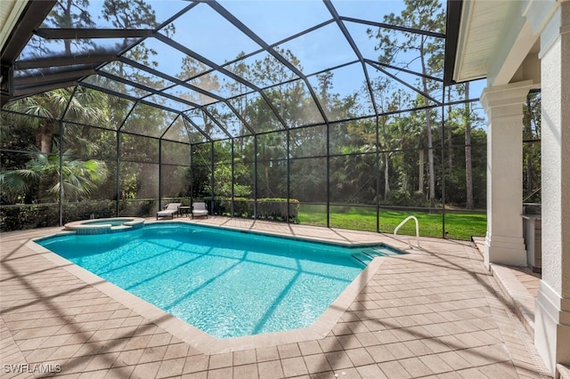 view of pool featuring a lanai, a patio area, and an in ground hot tub