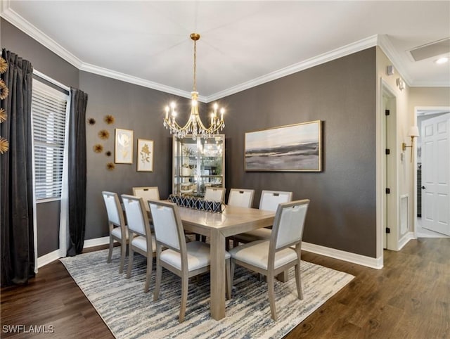 dining area featuring dark hardwood / wood-style flooring, ornamental molding, and a chandelier