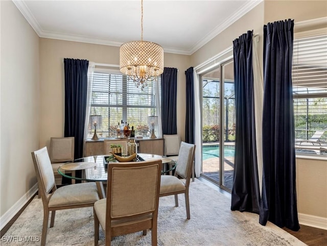 dining space featuring crown molding, hardwood / wood-style floors, and a notable chandelier