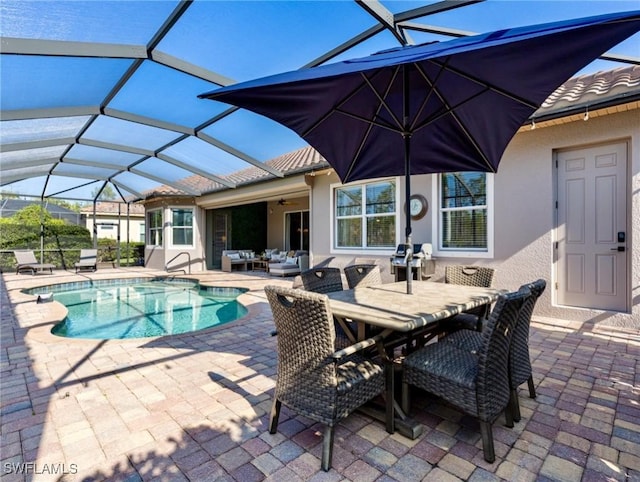 view of pool featuring a lanai, an outdoor hangout area, and a patio area