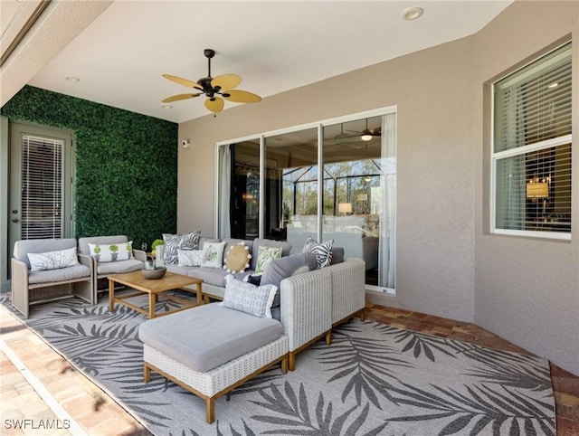 view of patio featuring an outdoor hangout area and ceiling fan