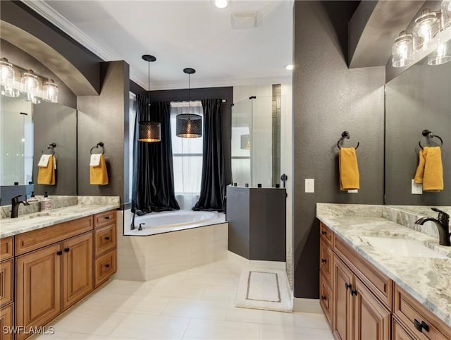 bathroom with ornamental molding, a bathing tub, and vanity