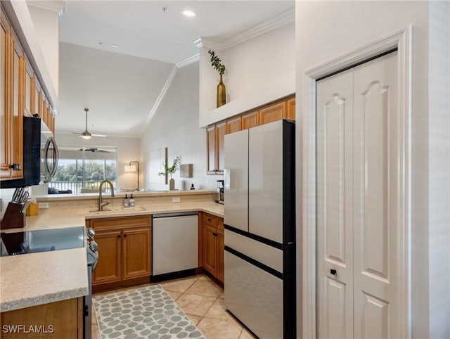 kitchen featuring sink, crown molding, light tile patterned floors, kitchen peninsula, and stainless steel appliances