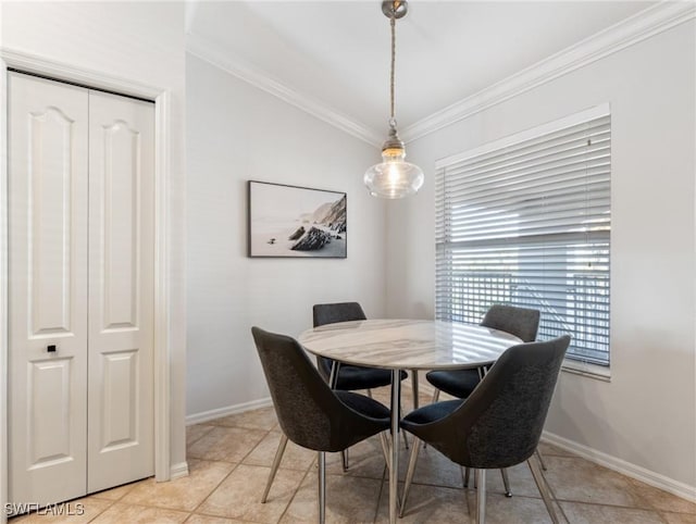 dining room featuring light tile patterned floors and crown molding