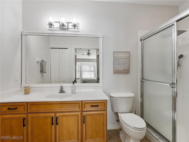 bathroom featuring walk in shower, vanity, and toilet