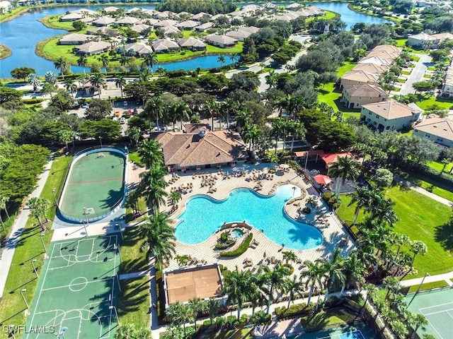 birds eye view of property with a water view