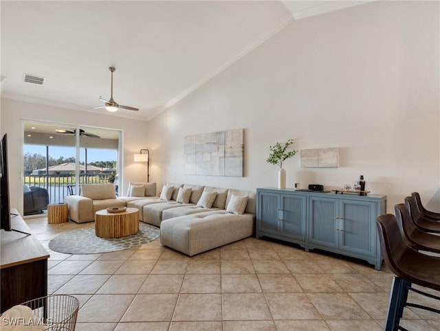 tiled living room with crown molding, ceiling fan, and high vaulted ceiling