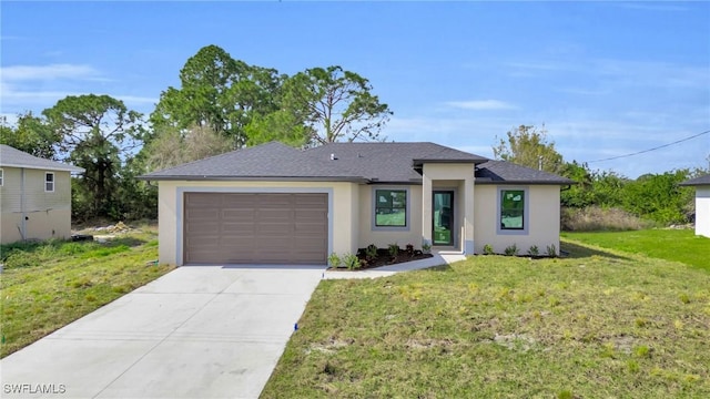 view of front of house featuring a garage and a front yard