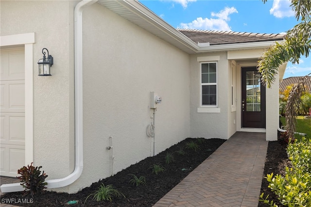 property entrance with a garage