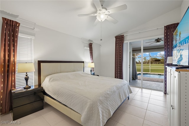 tiled bedroom featuring lofted ceiling, multiple windows, ceiling fan, and access to outside