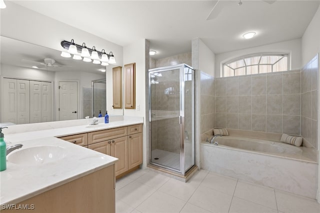 bathroom featuring vanity, tile patterned floors, ceiling fan, and independent shower and bath