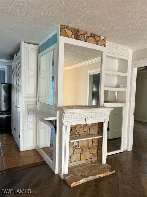 details featuring wood-type flooring, a textured ceiling, ceiling fan, and built in features