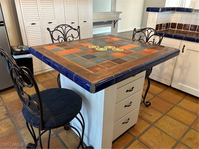 dining room with tile patterned floors