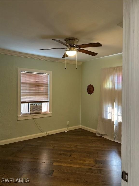 unfurnished room with cooling unit, dark hardwood / wood-style flooring, ceiling fan, and crown molding