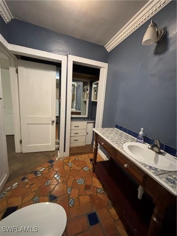 bathroom with vanity and toilet