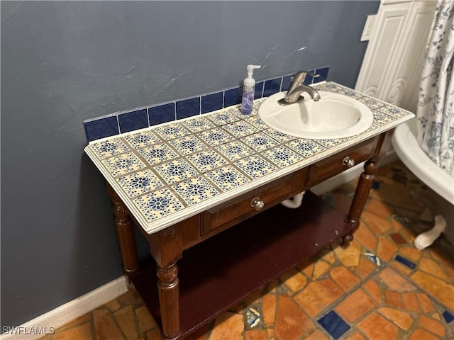 bathroom with tile patterned floors and sink