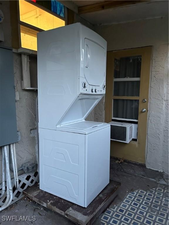 laundry room featuring stacked washer and dryer