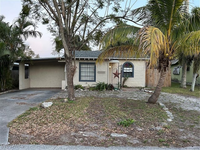 view of front of property featuring a carport