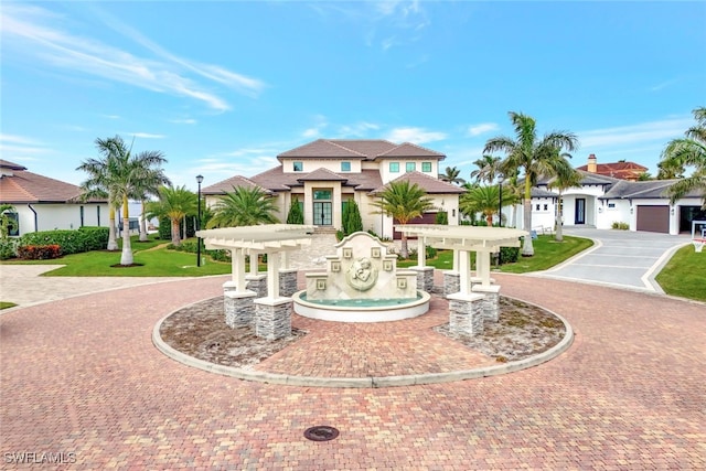 mediterranean / spanish-style home with a pergola