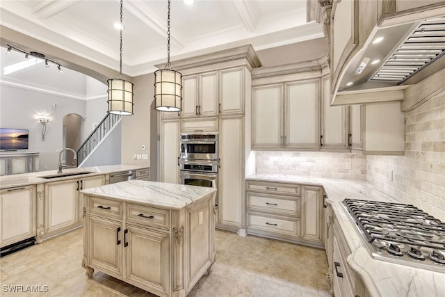 kitchen featuring sink, custom exhaust hood, a center island, pendant lighting, and stainless steel appliances