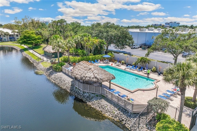 view of swimming pool with a gazebo, a patio, and a water view