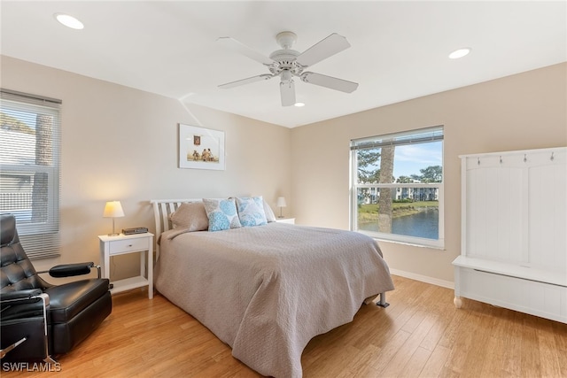 bedroom featuring ceiling fan and light wood-type flooring