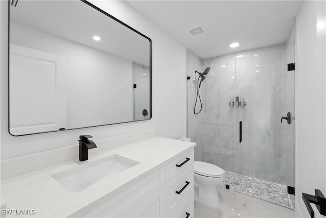 bathroom with vanity, toilet, and walk in shower