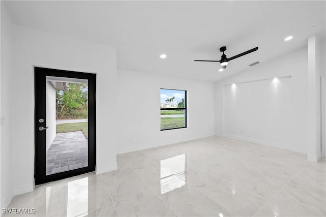 empty room with ceiling fan and lofted ceiling