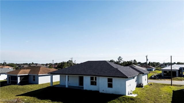 exterior space with a lawn and cooling unit