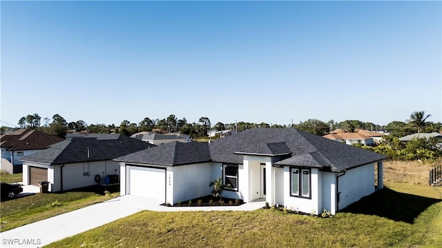 view of front facade with a front lawn and a garage