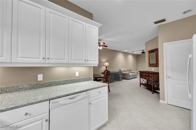 kitchen with white cabinets, ceiling fan, light tile patterned floors, white dishwasher, and light stone countertops