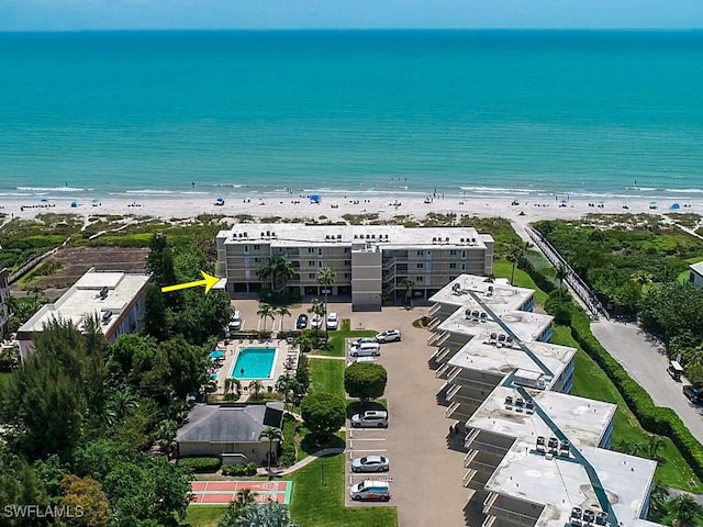 bird's eye view with a beach view and a water view