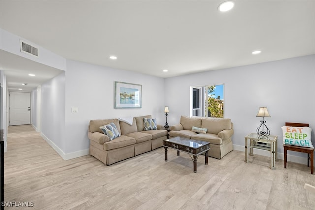 living room with light hardwood / wood-style floors