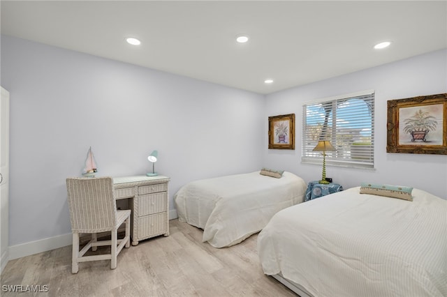 bedroom with light hardwood / wood-style floors