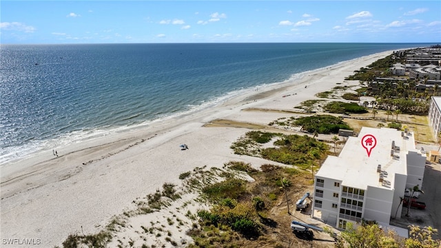 aerial view featuring a water view and a beach view