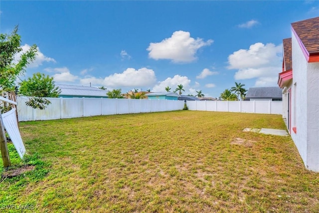 view of yard with a fenced backyard