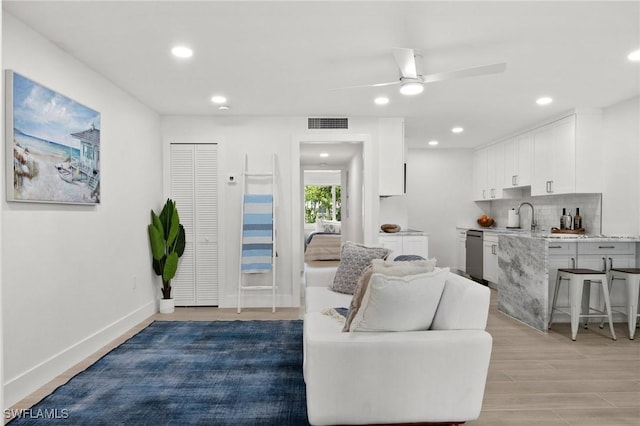 342 Harbour Dr, Naples, FL 34103 - living room with a ceiling fan, visible vents, recessed lighting, and light wood finished floors
