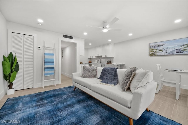 living room with ceiling fan