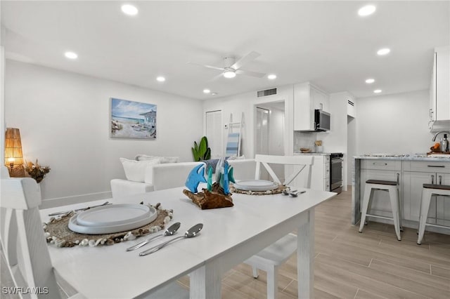 342 Harbour Dr, Naples, FL 34103 - dining room featuring visible vents, recessed lighting, light wood finished floors, and ceiling fan
