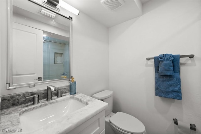 342 Harbour Dr, Naples, FL 34103 - bathroom featuring vanity, a stall shower, toilet, and visible vents