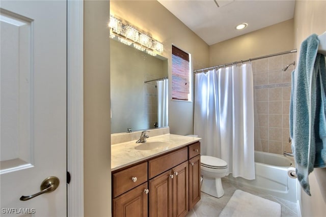 full bathroom with tile patterned flooring, shower / bath combination with curtain, vanity, and toilet