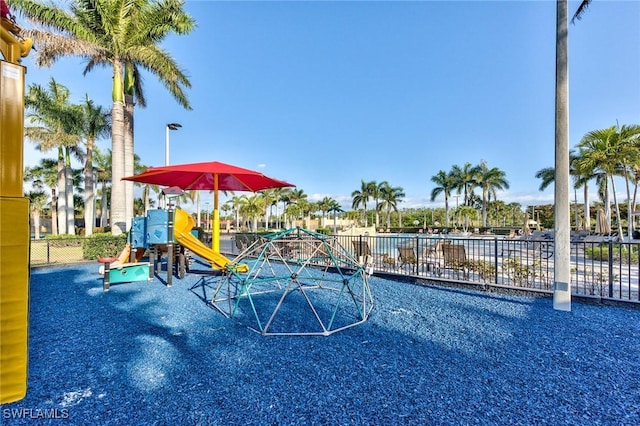 view of swimming pool featuring a playground