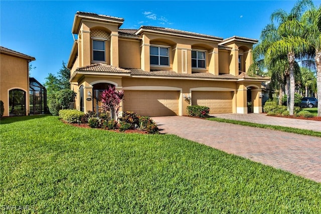 mediterranean / spanish-style house with a front lawn and a garage